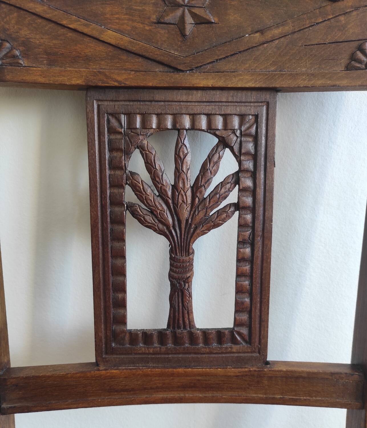 Armchair, low carved chair from the 19th century - decorated with wheat ears.