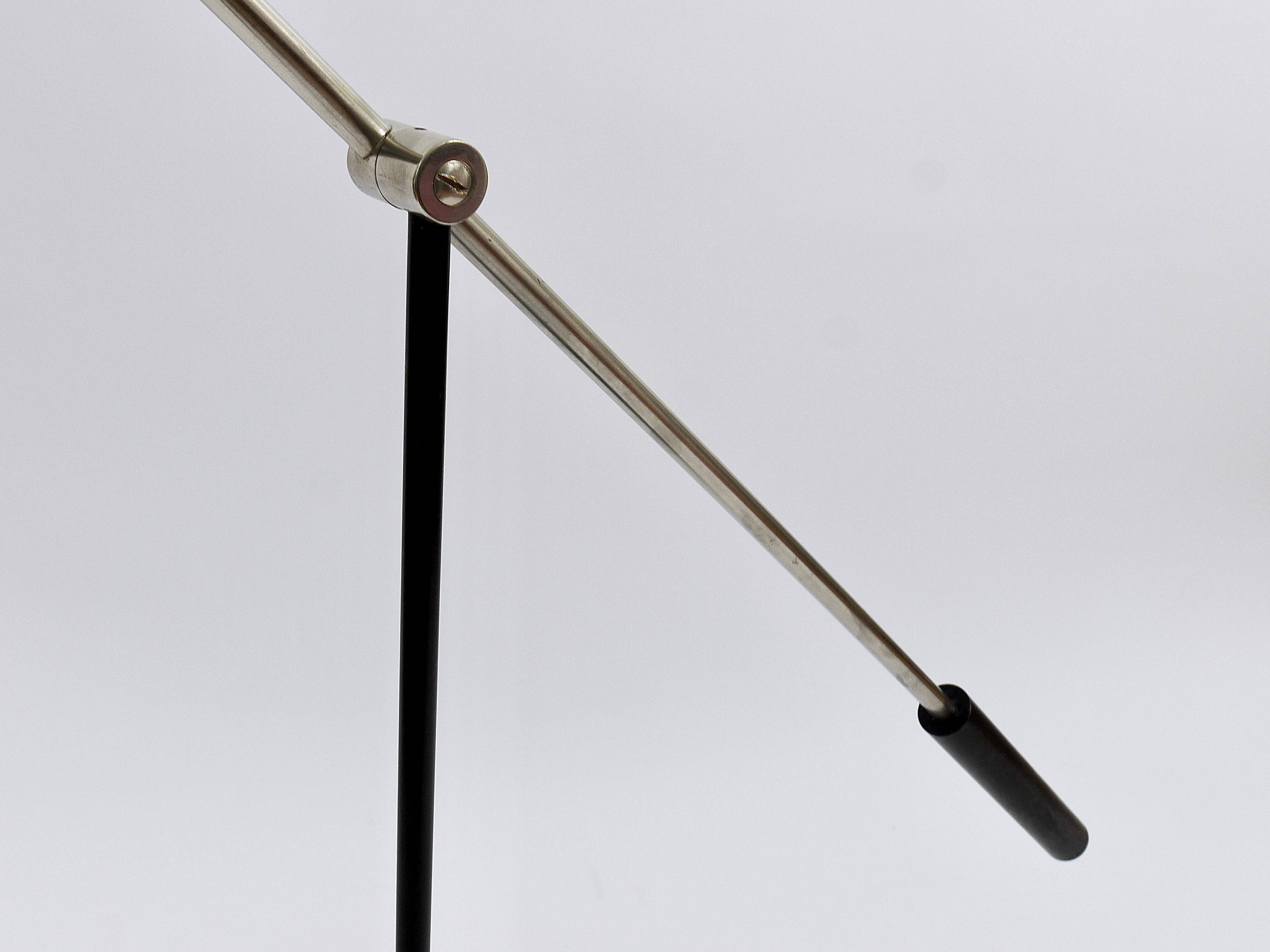 Articulated floor lamp with counterweight mid-century by Rupert Nikoll, nickel, brass.