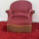 Toad in powder pink velvet armchair