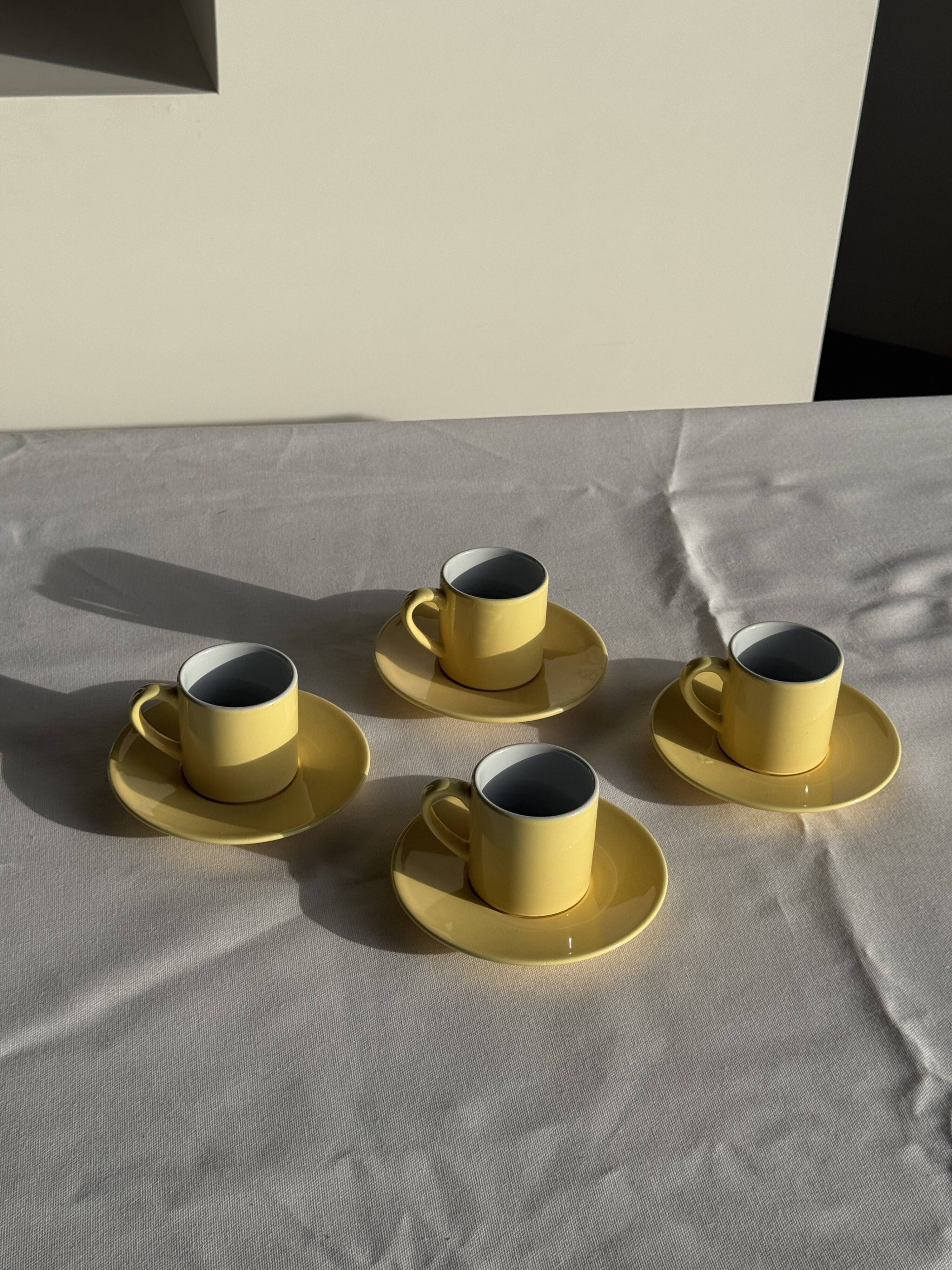 Set of 4 vintage yellow Italian espresso cups and saucers.