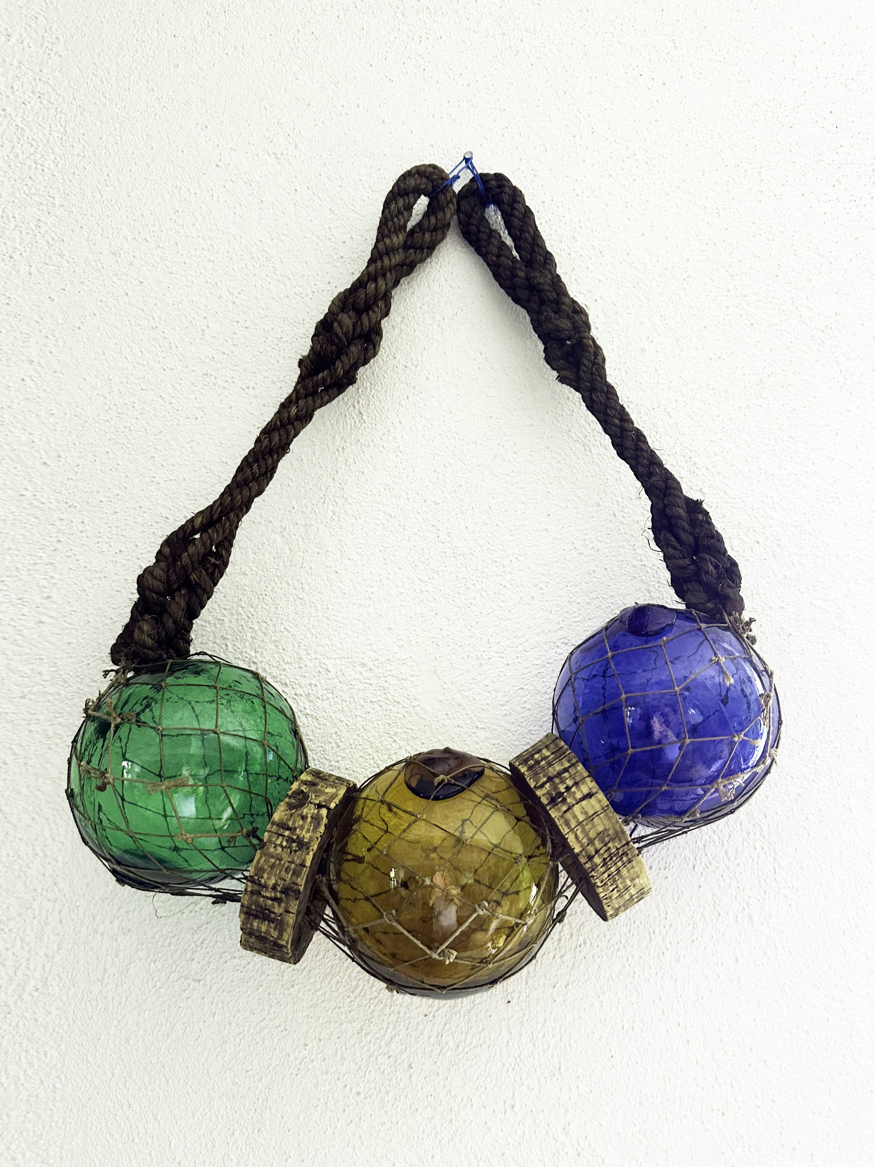 Fishing floats made of blown glass, cork, and rope. France, 1960s.