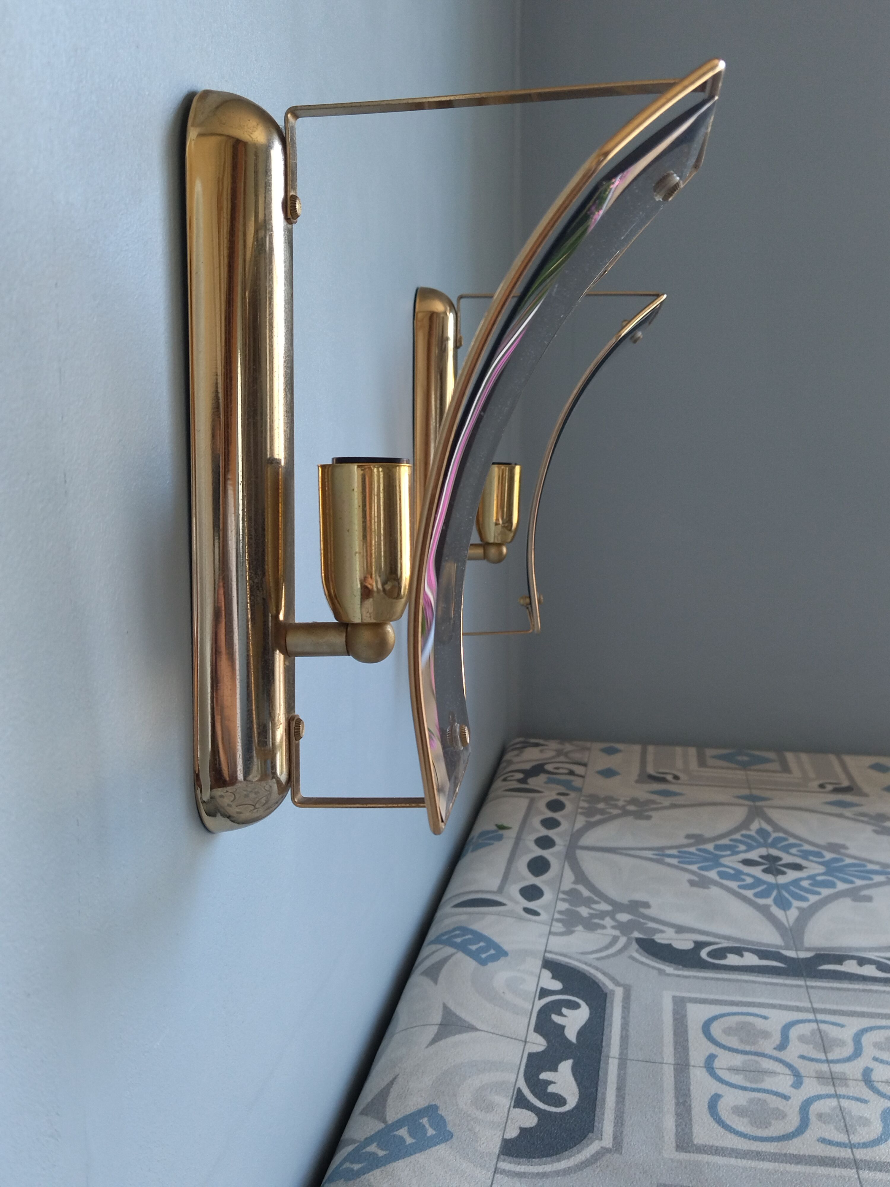 Pair of brass and curved glass wall lamps from the 80s