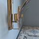 Pair of brass and curved glass wall lamps from the 80s