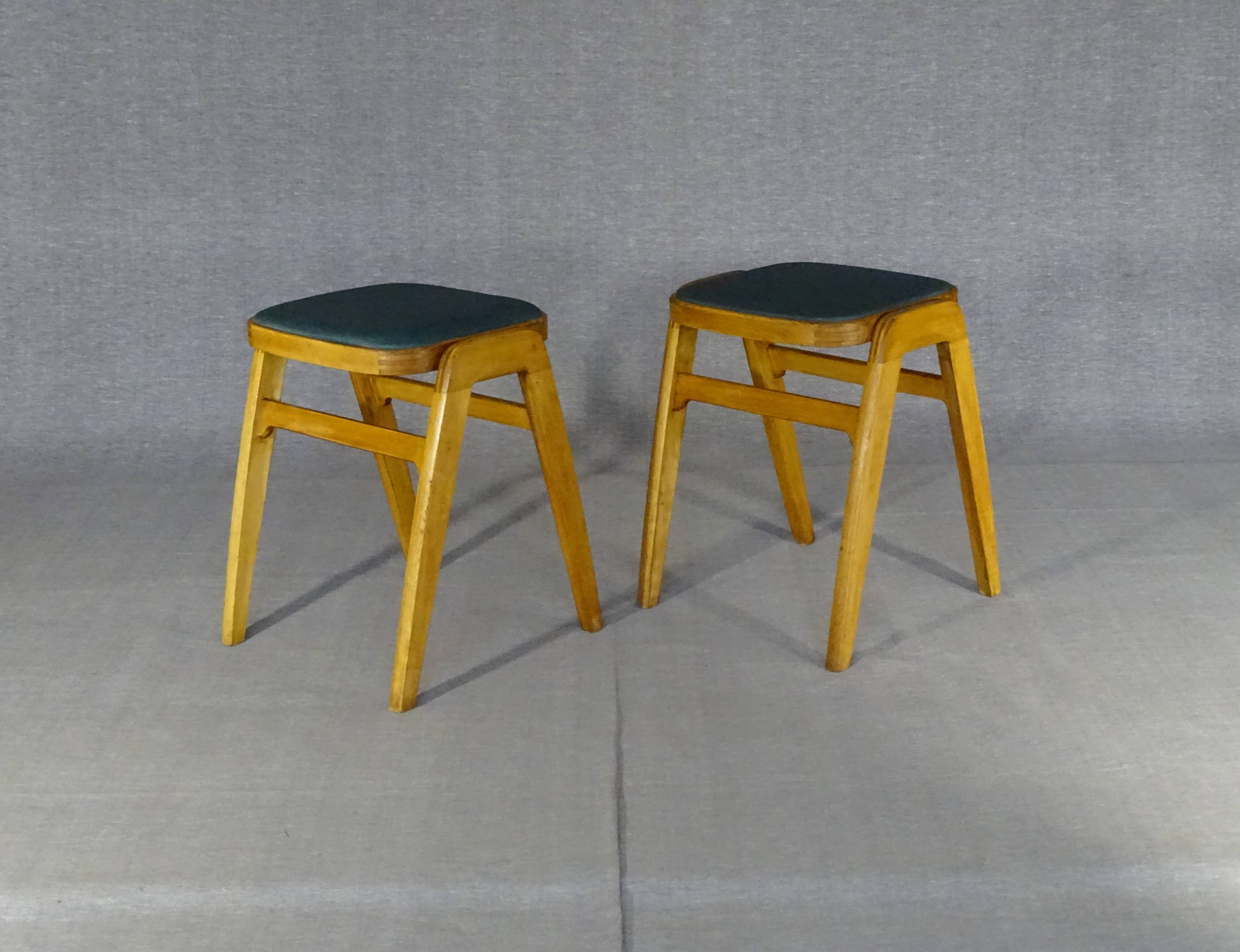 2 Mid-century green vinyl stools with compass legs from the 1960s.