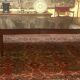 Extensible dining table from the Louis XVI period in mahogany with a banded top.