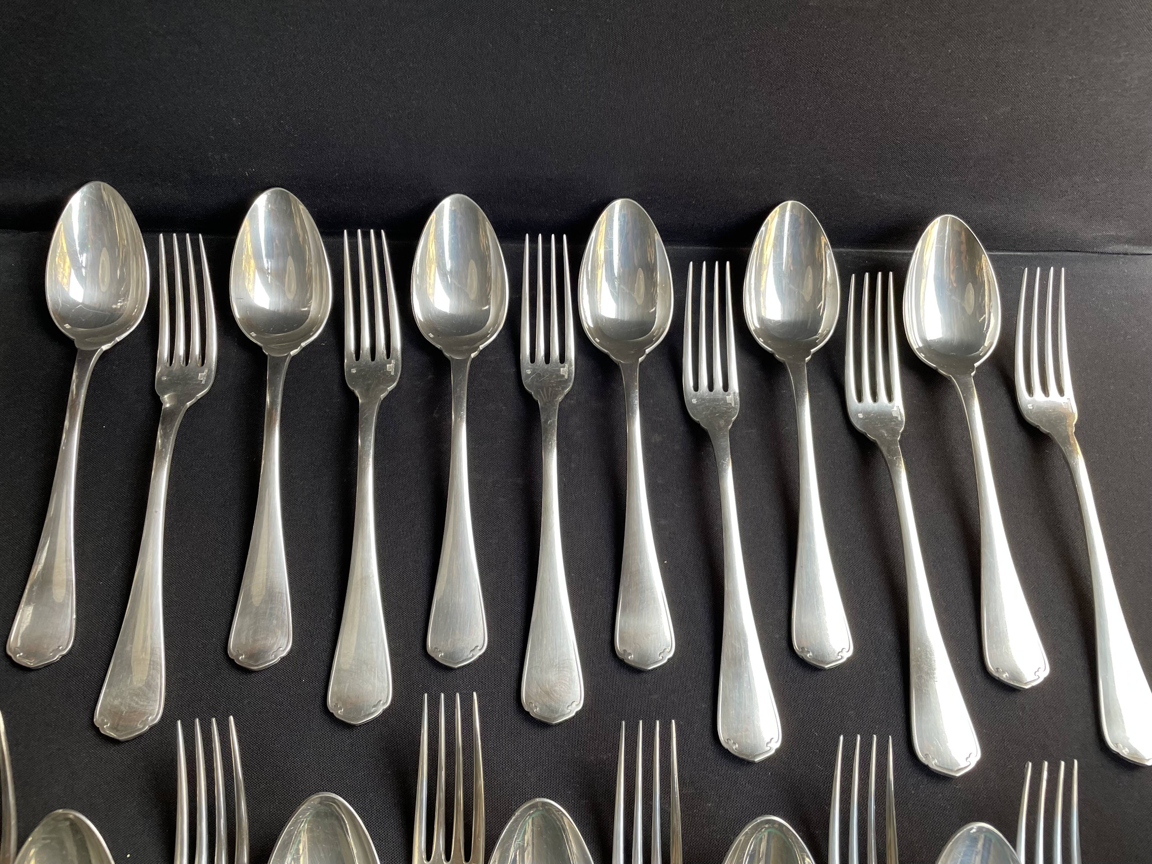 12 Christofle table forks and 12 spoons