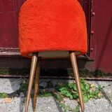 Orange furry barrel chair