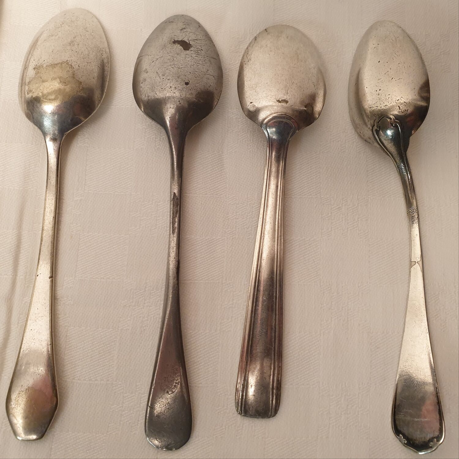 Set of mismatched silvered metal cutlery