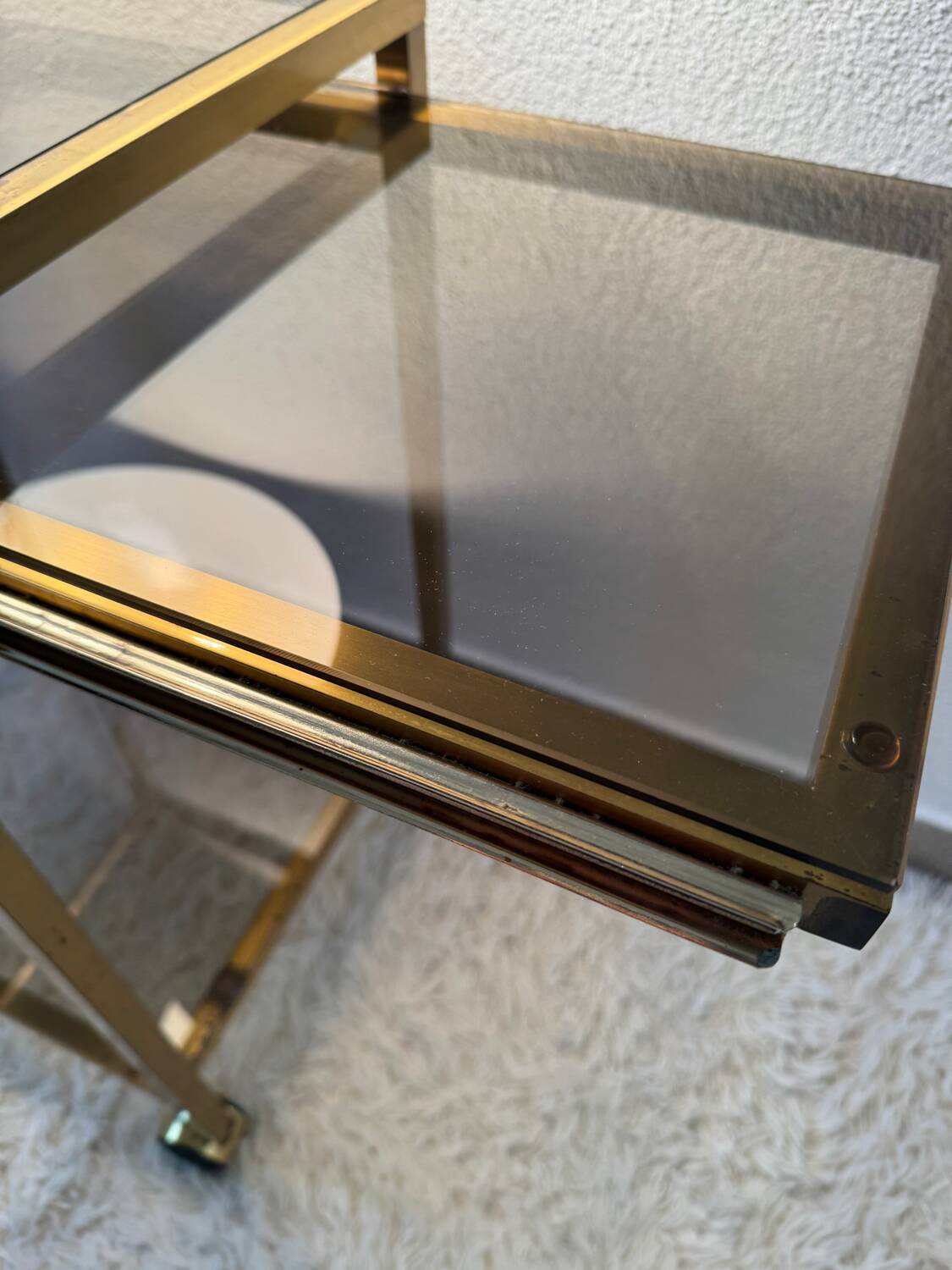 Brass rolling trolley with smoked glass from the 70s