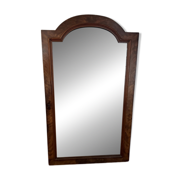 Large curved mirror with a wooden frame