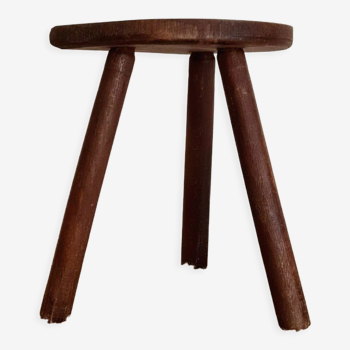 Old wooden tripod wooden farm stool made of wood