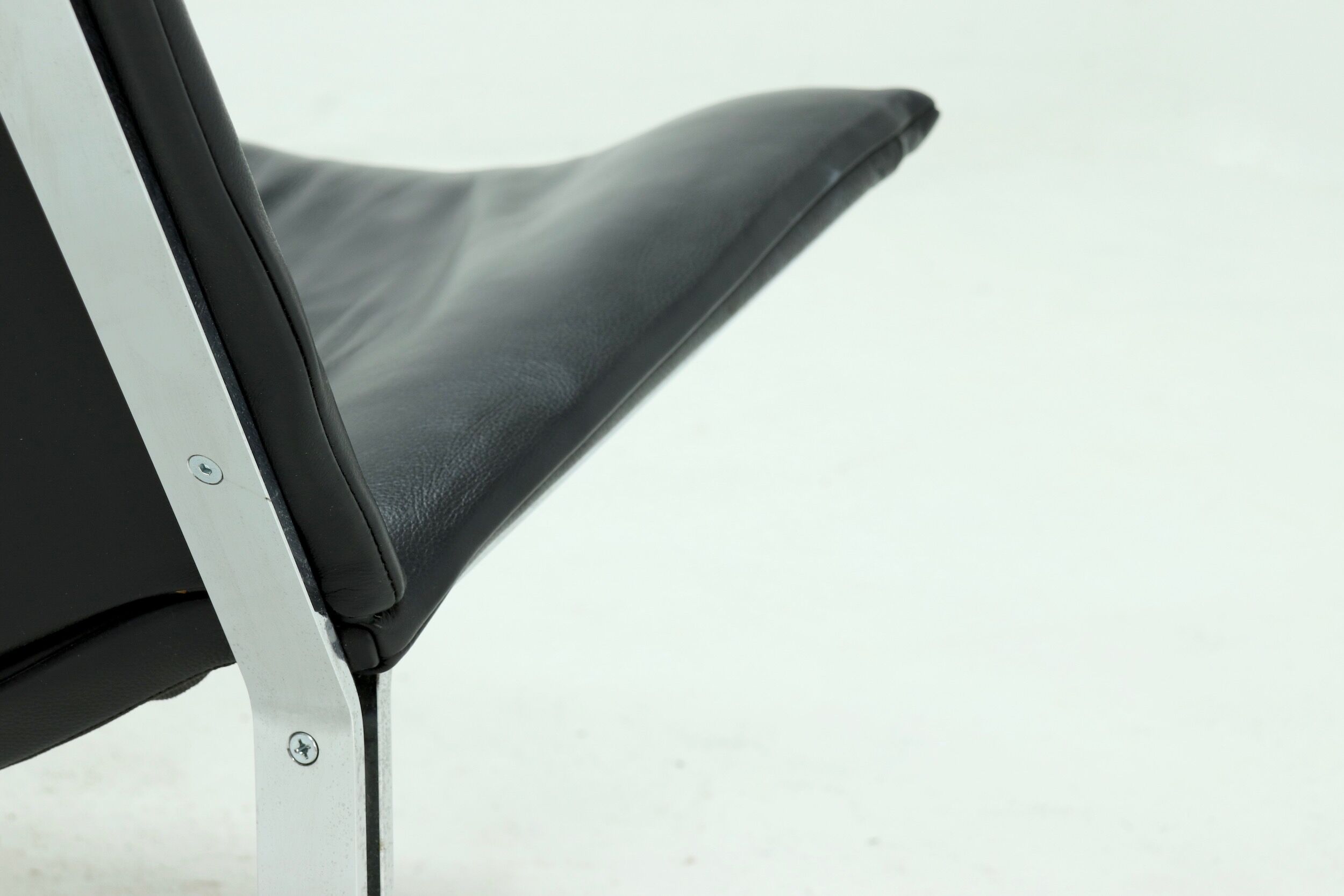 Set of 2 Danish lounge chairs by Kebe Møbler model Eagle with black leather.