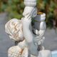 Pair of "cherub" candle holders in plaster