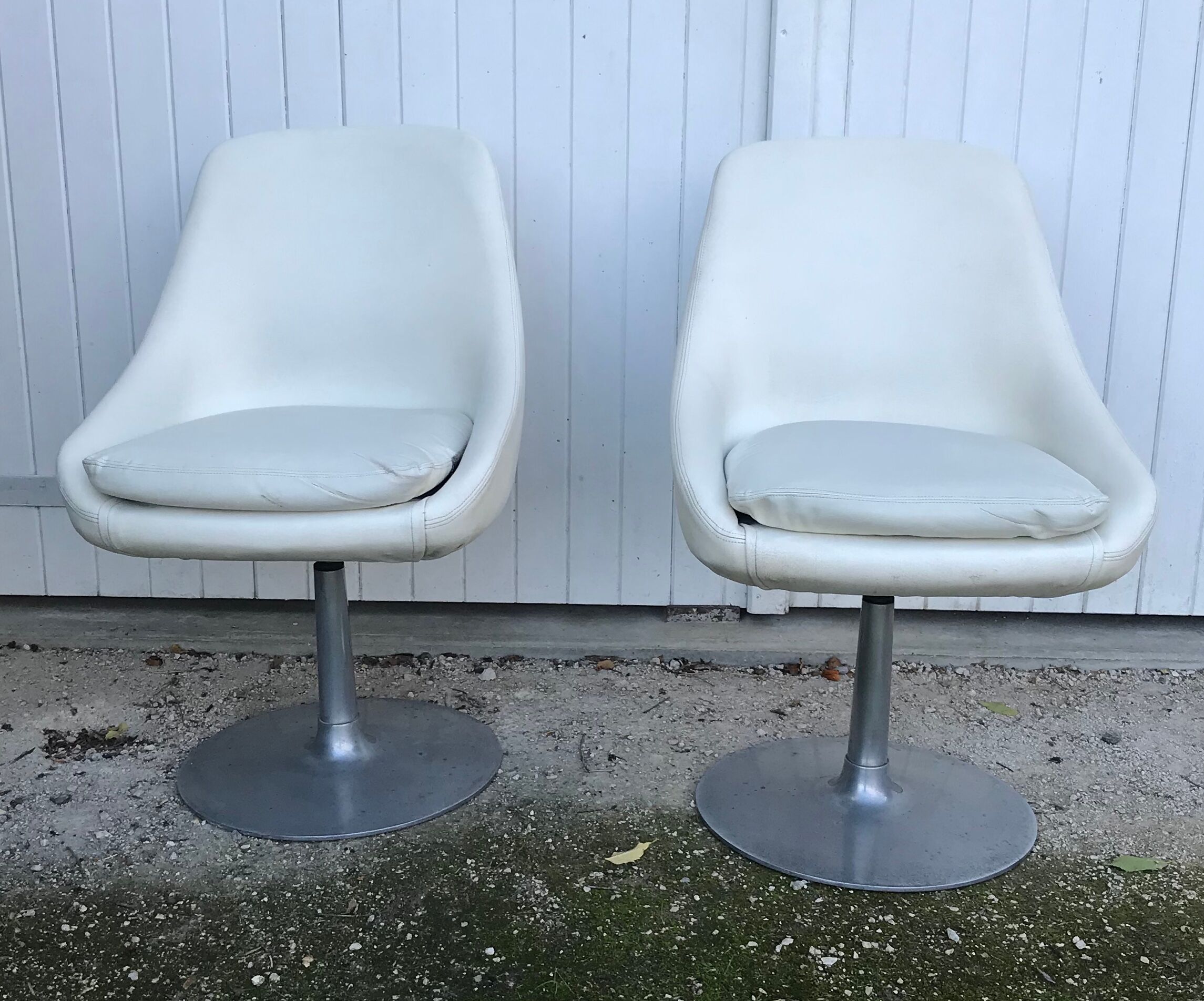Pair of vintage armchairs with swivel tulip feet