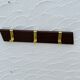 Vintage wooden and brass coat rack with 3 hooks from the 1960s.