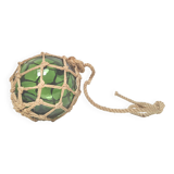 Green ball marine float in glass and rope