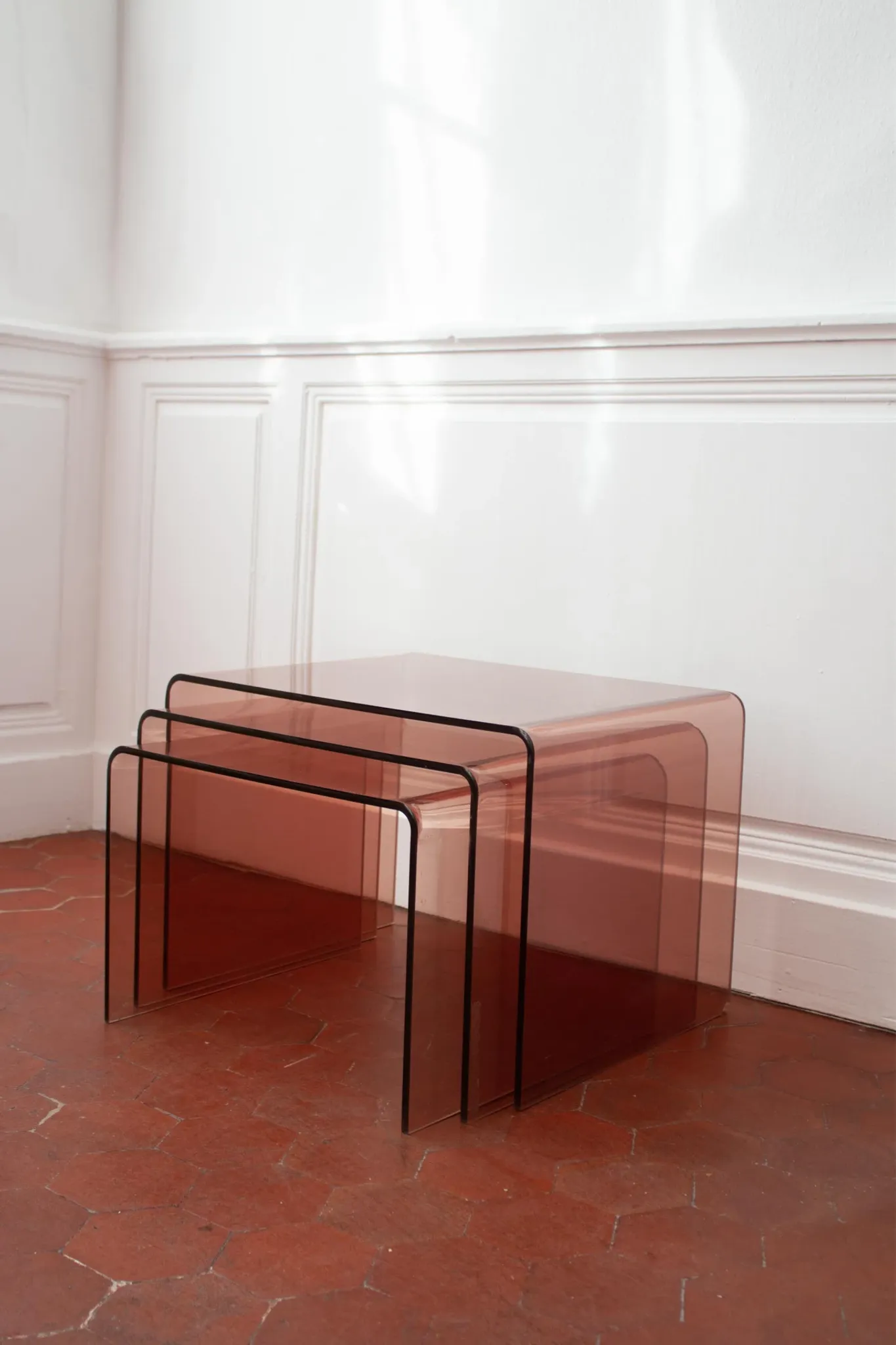 Vintage trio of nesting tables in smoked plexiglass by Michel Dumas, year