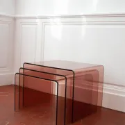 Vintage trio of nesting tables in smoked plexiglass by Michel Dumas, year