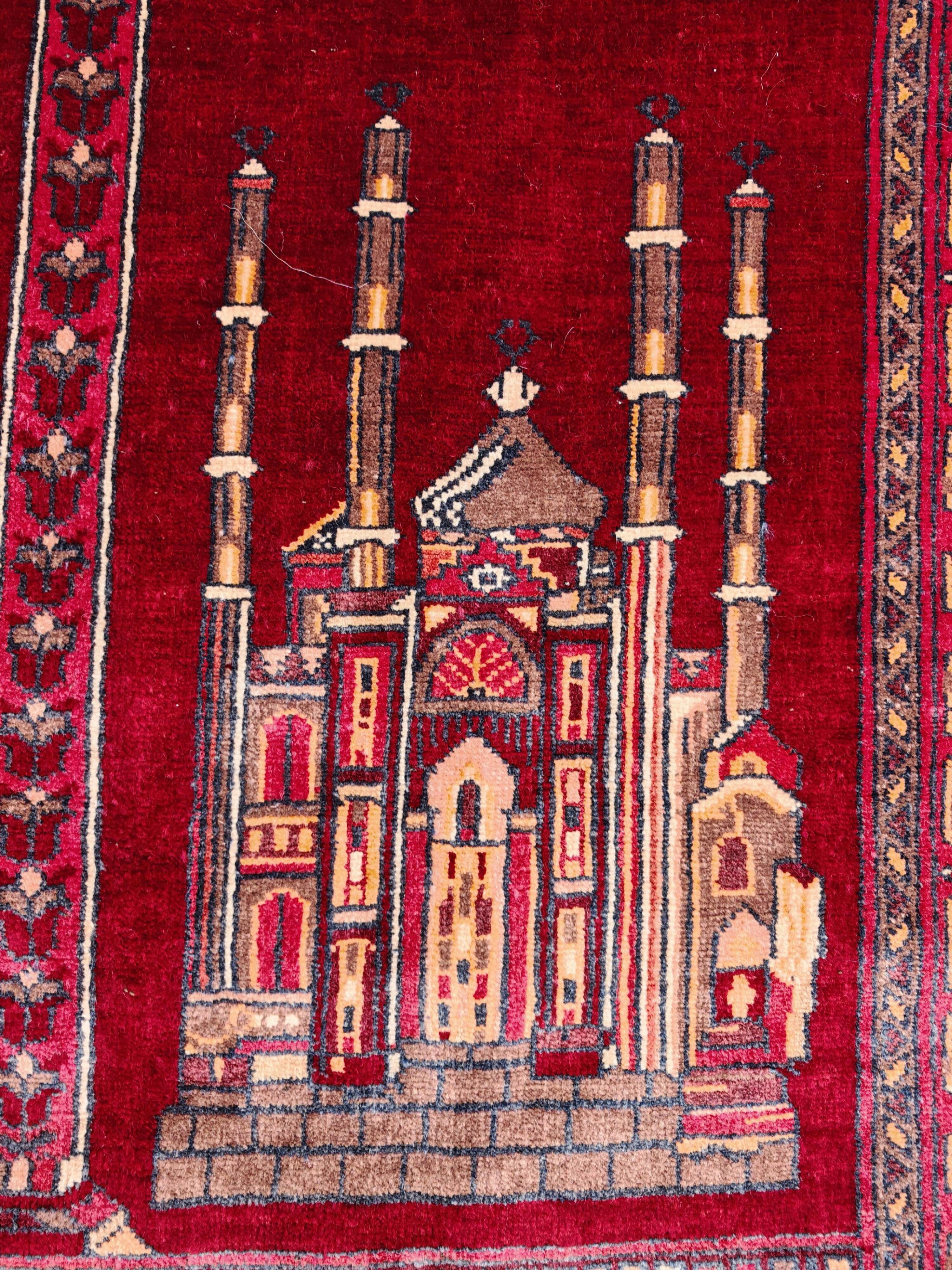 Vintage Afghan hand-knotted prayer rug with Islamic patterns.