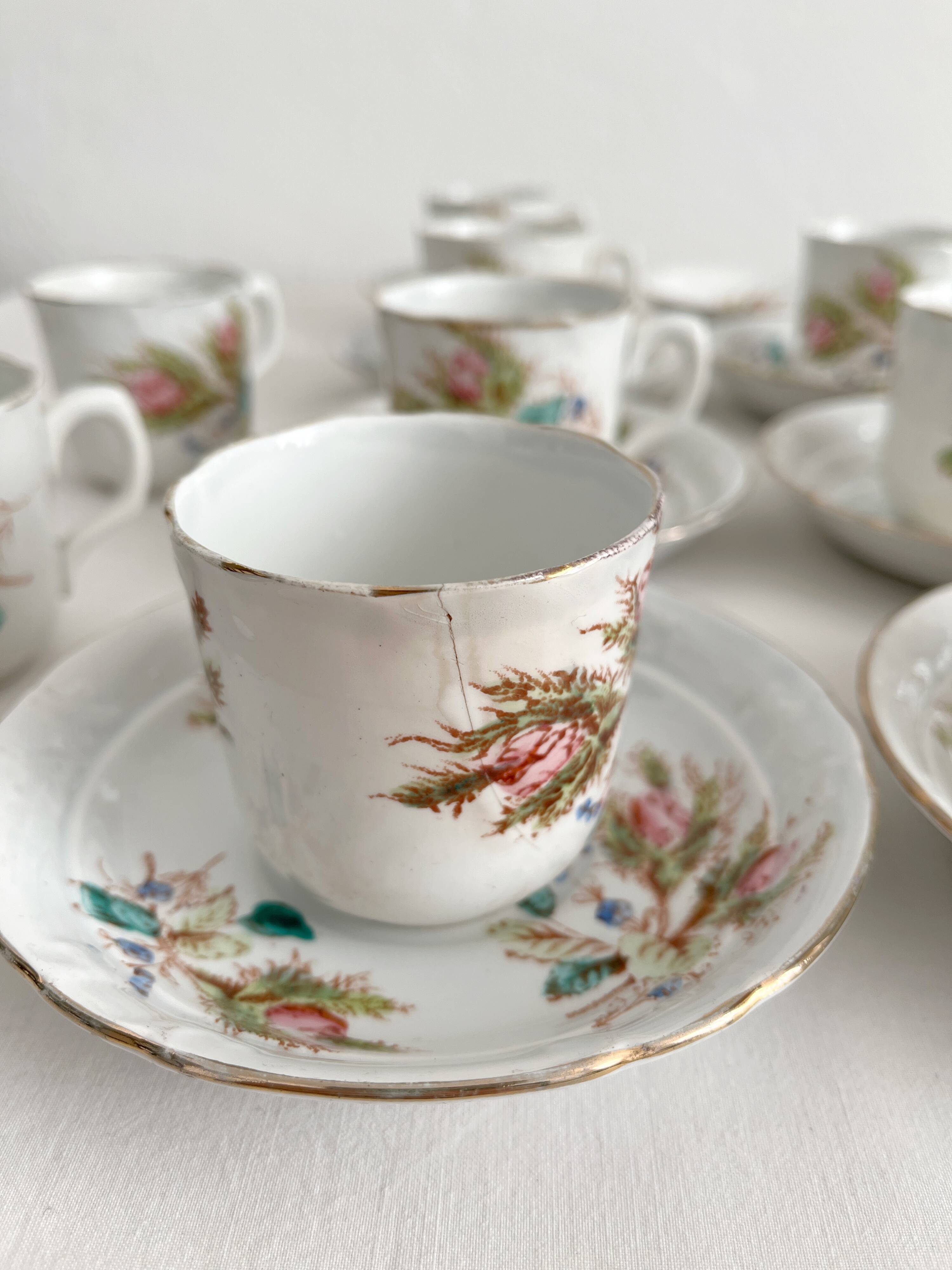 12 ironstone coffee cups with polychrome floral decoration, KG Lunéville