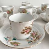 12 ironstone coffee cups with polychrome floral decoration, KG Lunéville