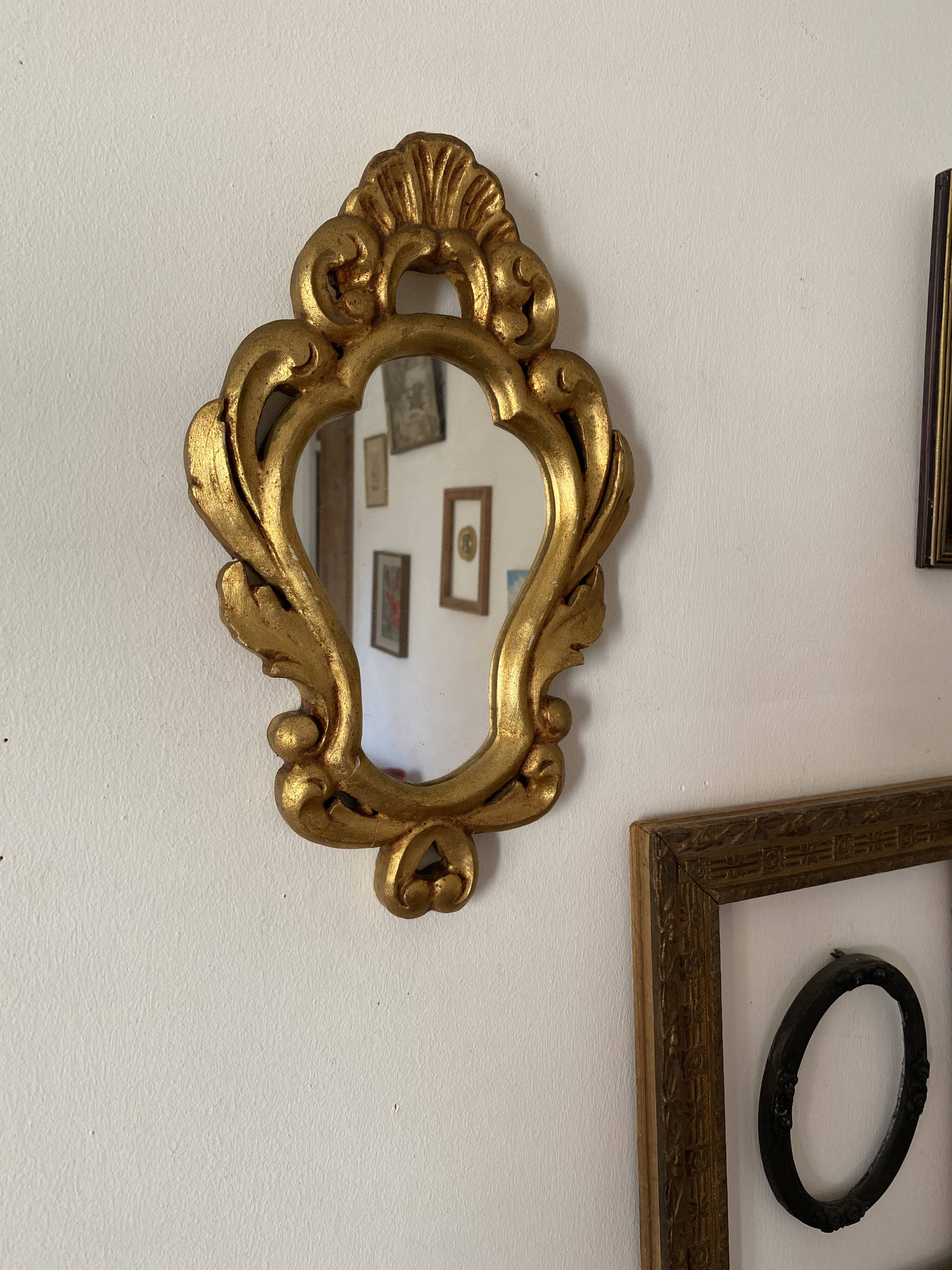 Golden mirror in baroque style.