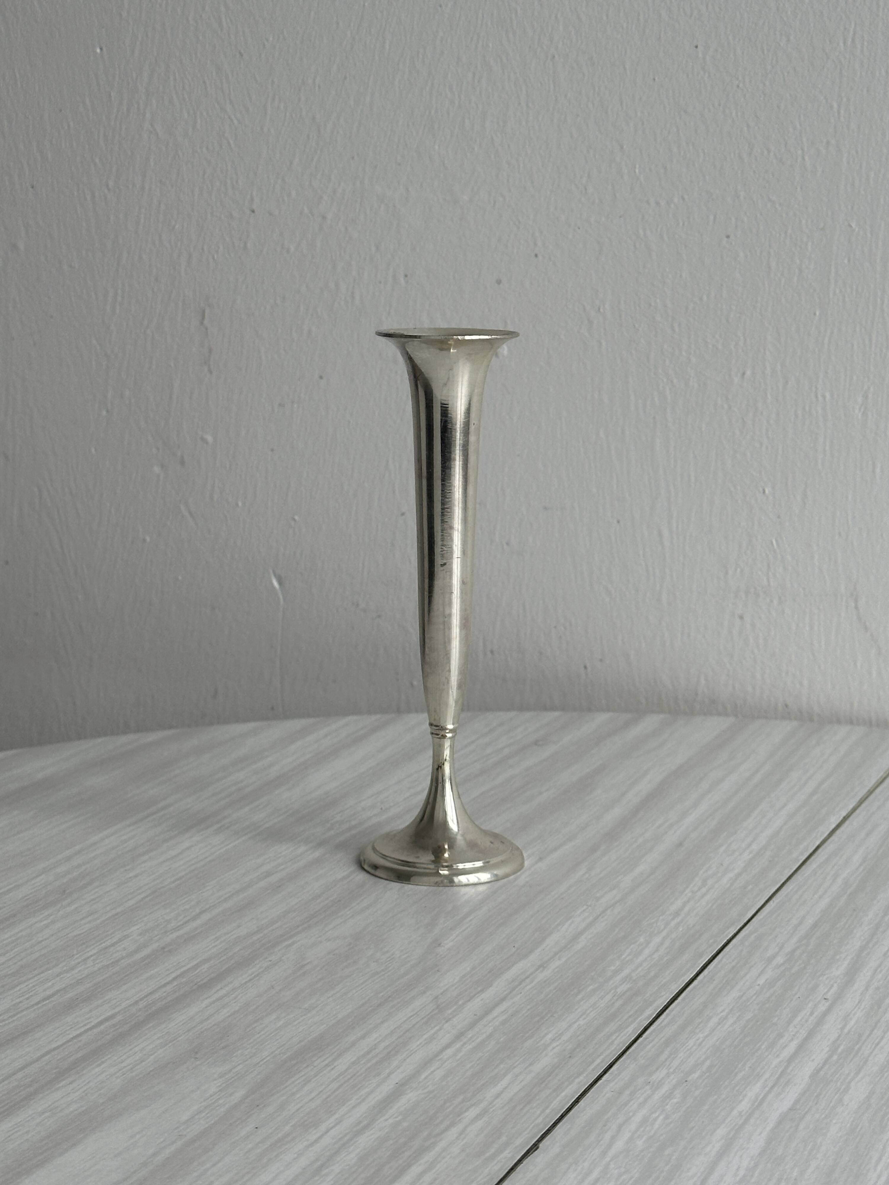 Small shiny metal bud vase