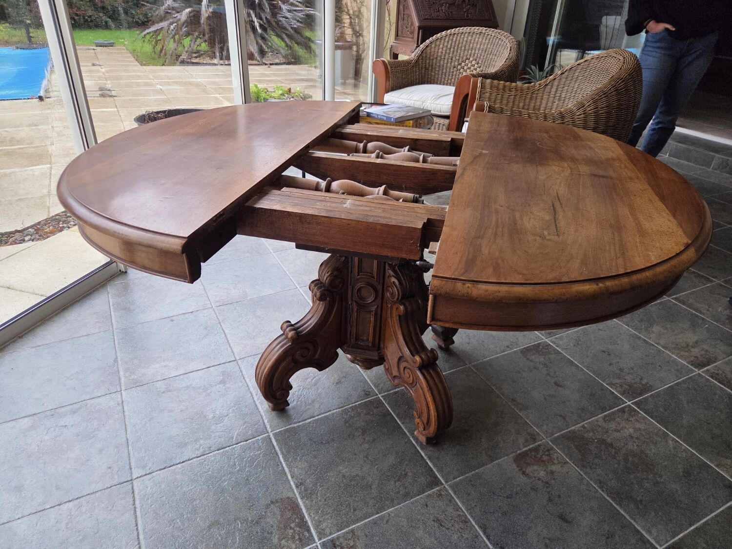Extendable walnut table in the Napoleon III style.