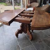 Extendable walnut table in the Napoleon III style.