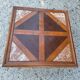 Coffee table with wood marquetry and marble inlays.