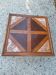 Coffee table with wood marquetry and marble inlays.