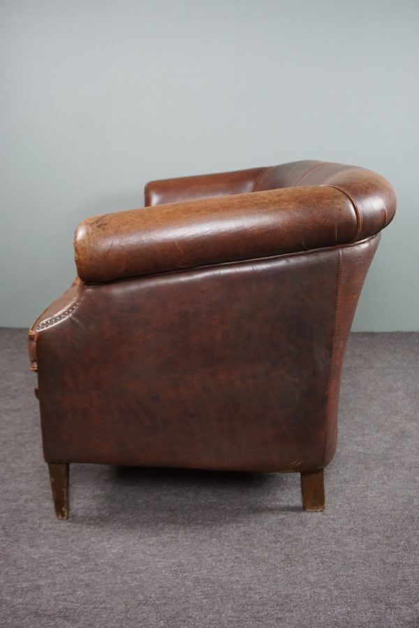 2-seater sofa in sheepskin decorative nails