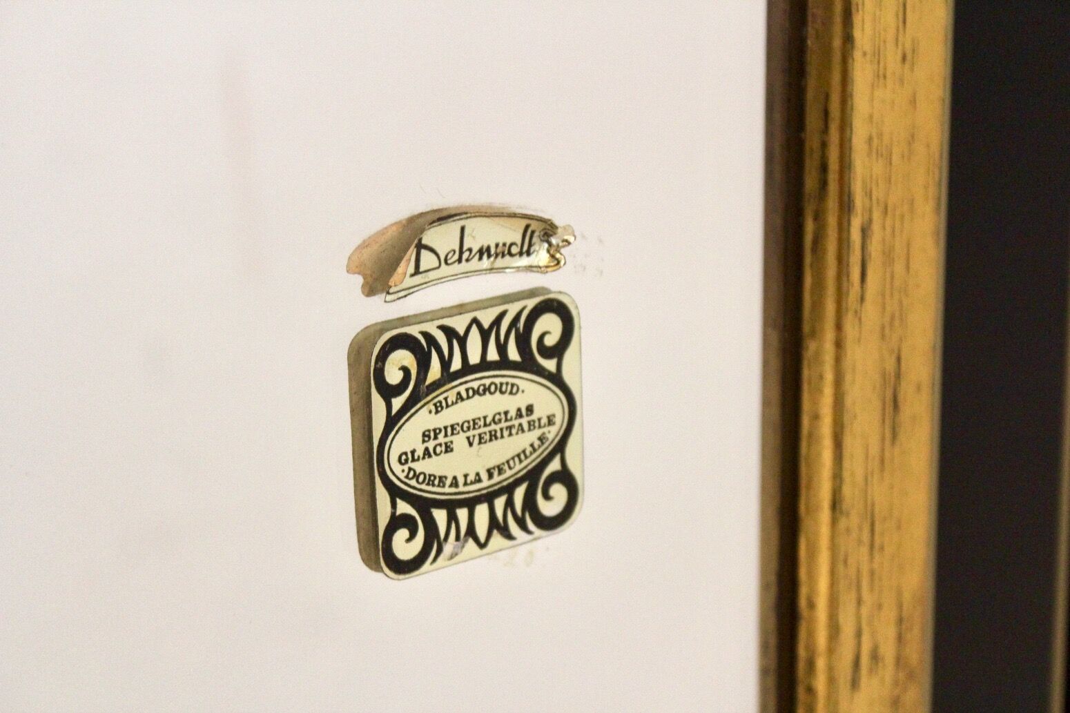 Mirror in gilded wood and black glass by Deknudt Belgium