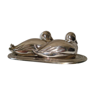 Salt and pepper shaker on silver metal tray in the shape of a duck art deco style