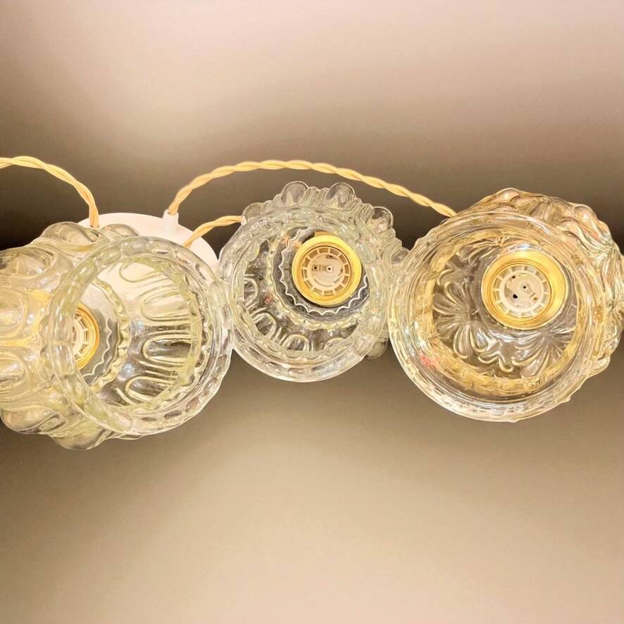 Cascade pendant light with 3 molded glass globes in vintage arabesque amber glass