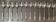 12 small Christofle Marly silver-plated spoons in the mascaron pattern.