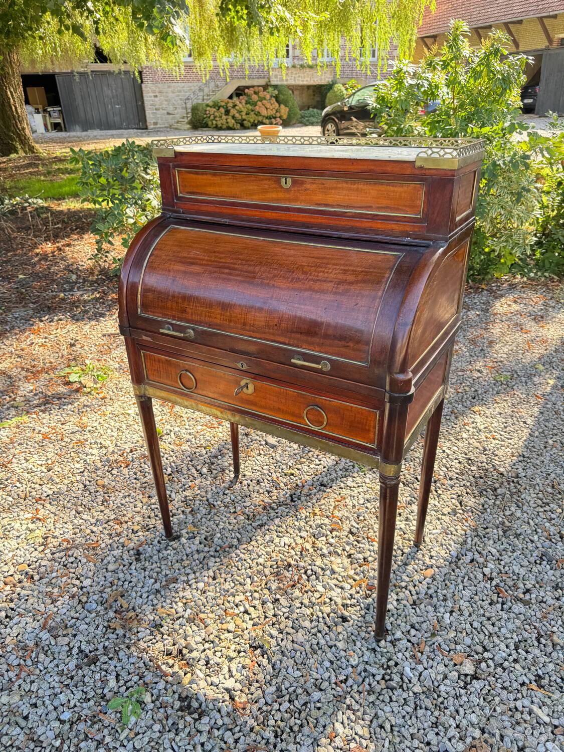 Elegant and rare Louis XVI period mahogany cylinder desk