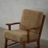 Danish modernist lounge chair in oak and lambswool, Henning Kjærnulf, 1960s