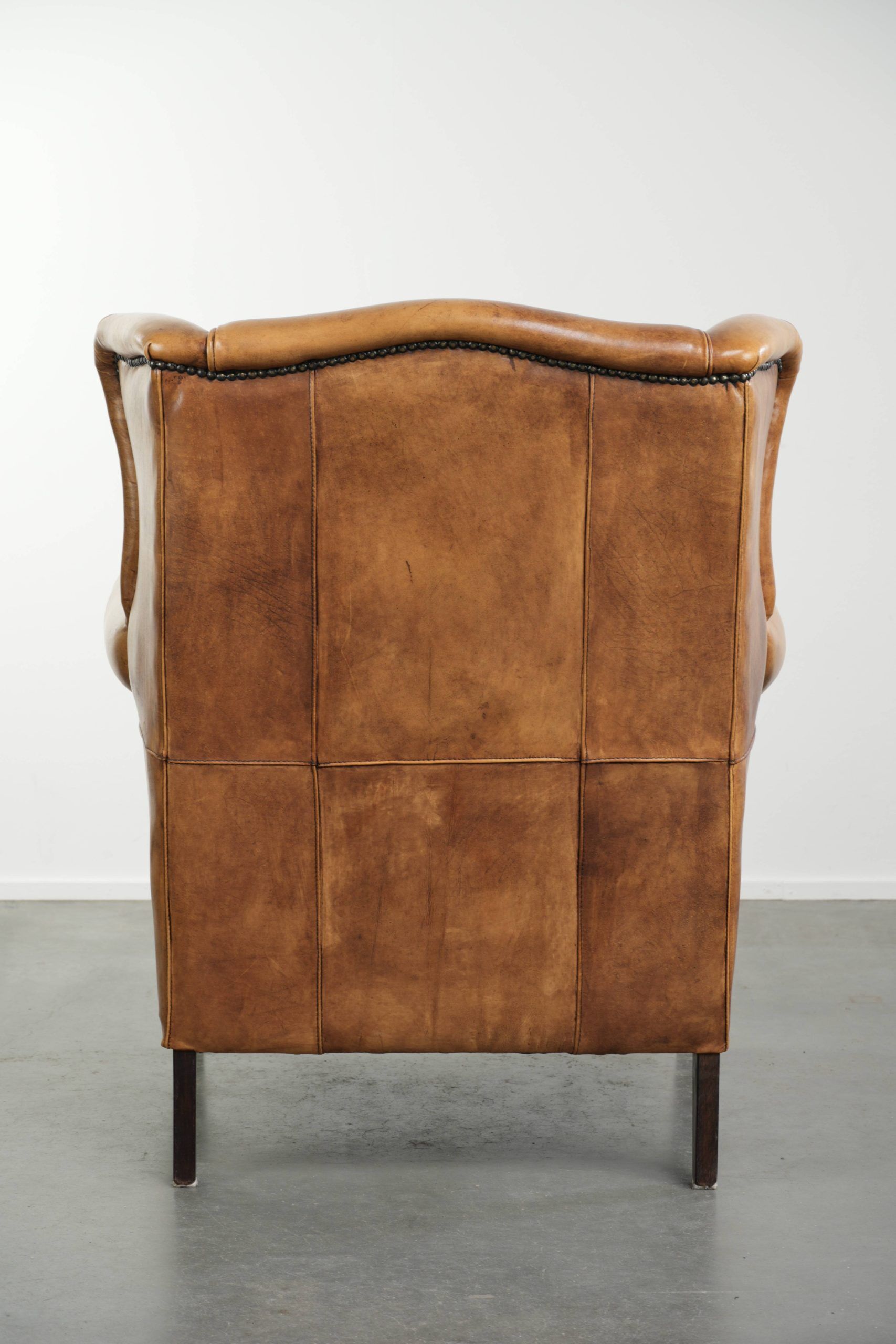 Cow leather wingback armchair with a beautiful timeless English look