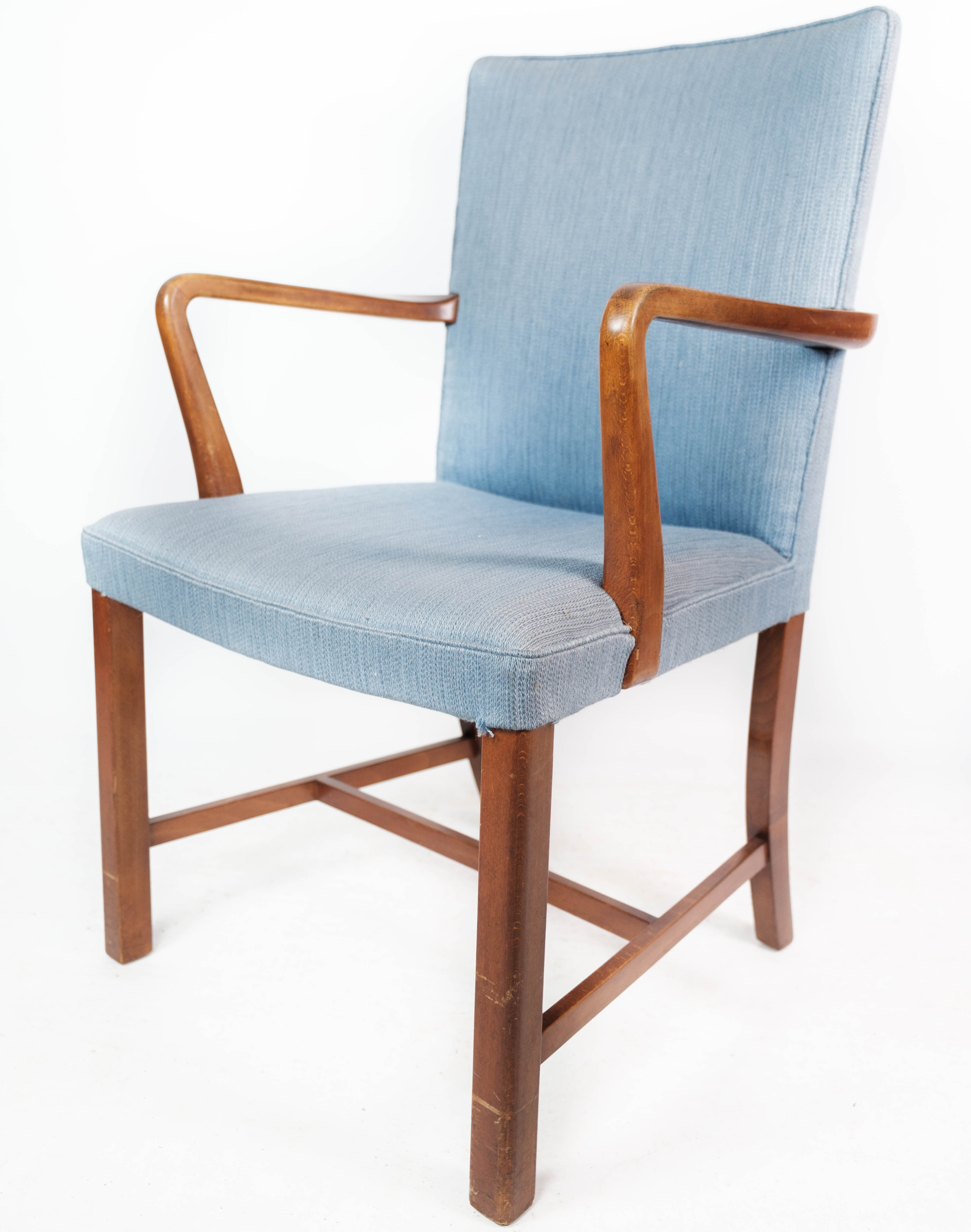 Armchair in mahogany and upholstered with light blue fabric by Fritz Hansen
