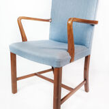Armchair in mahogany and upholstered with light blue fabric by Fritz Hansen