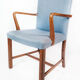 Armchair in mahogany and upholstered with light blue fabric by Fritz Hansen