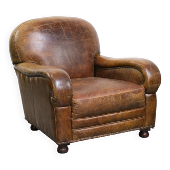 Vintage grained cowhide leather armchair with rounded shapes