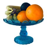 Coupe sur pied en verre bleu