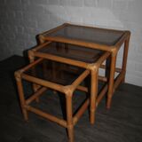 Rattan nesting tables in rattan and smoked glass from the 70s