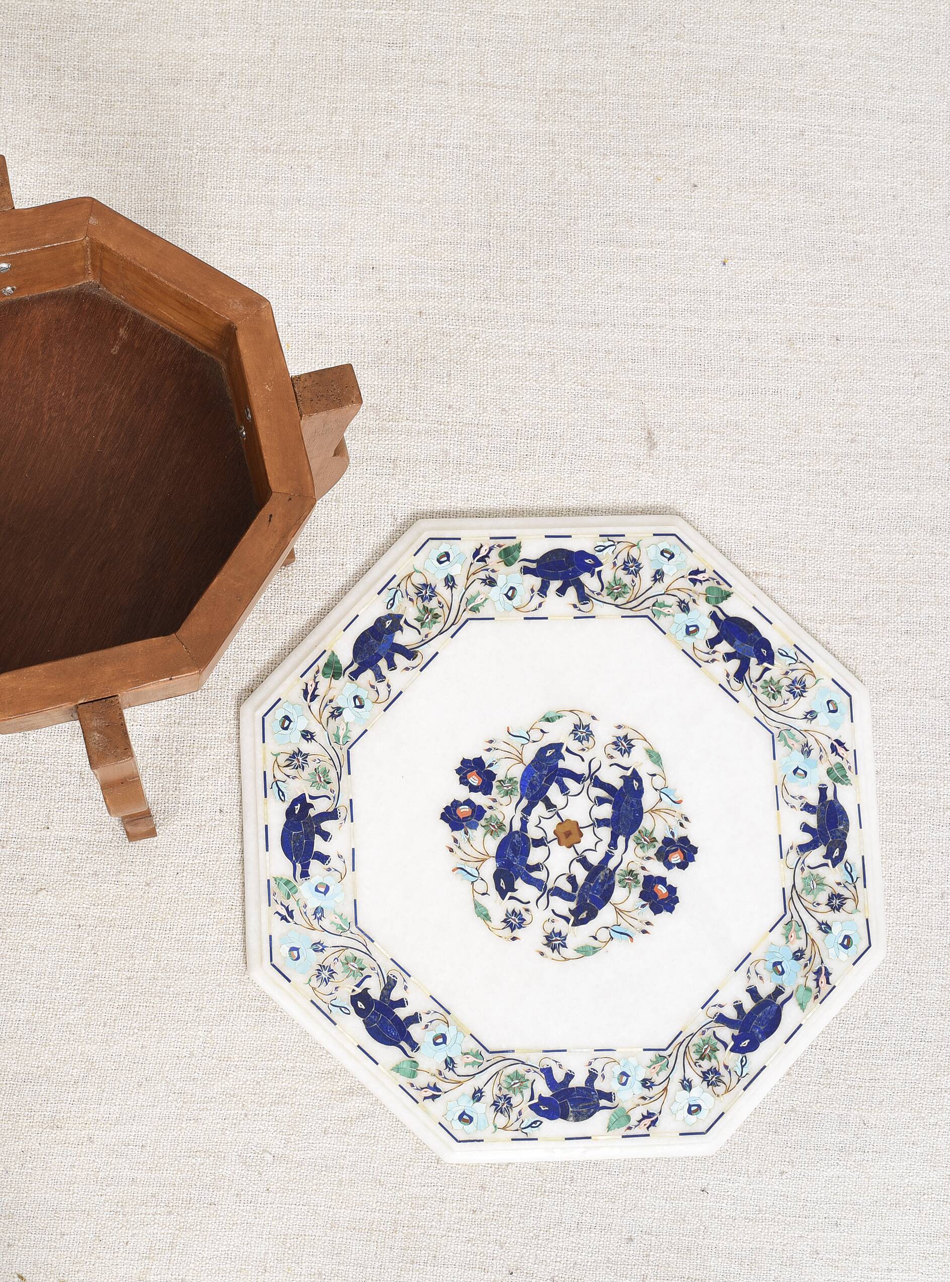 Side table with marble top and inlaid stones