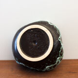 Empty pocket in black ceramic with green drip