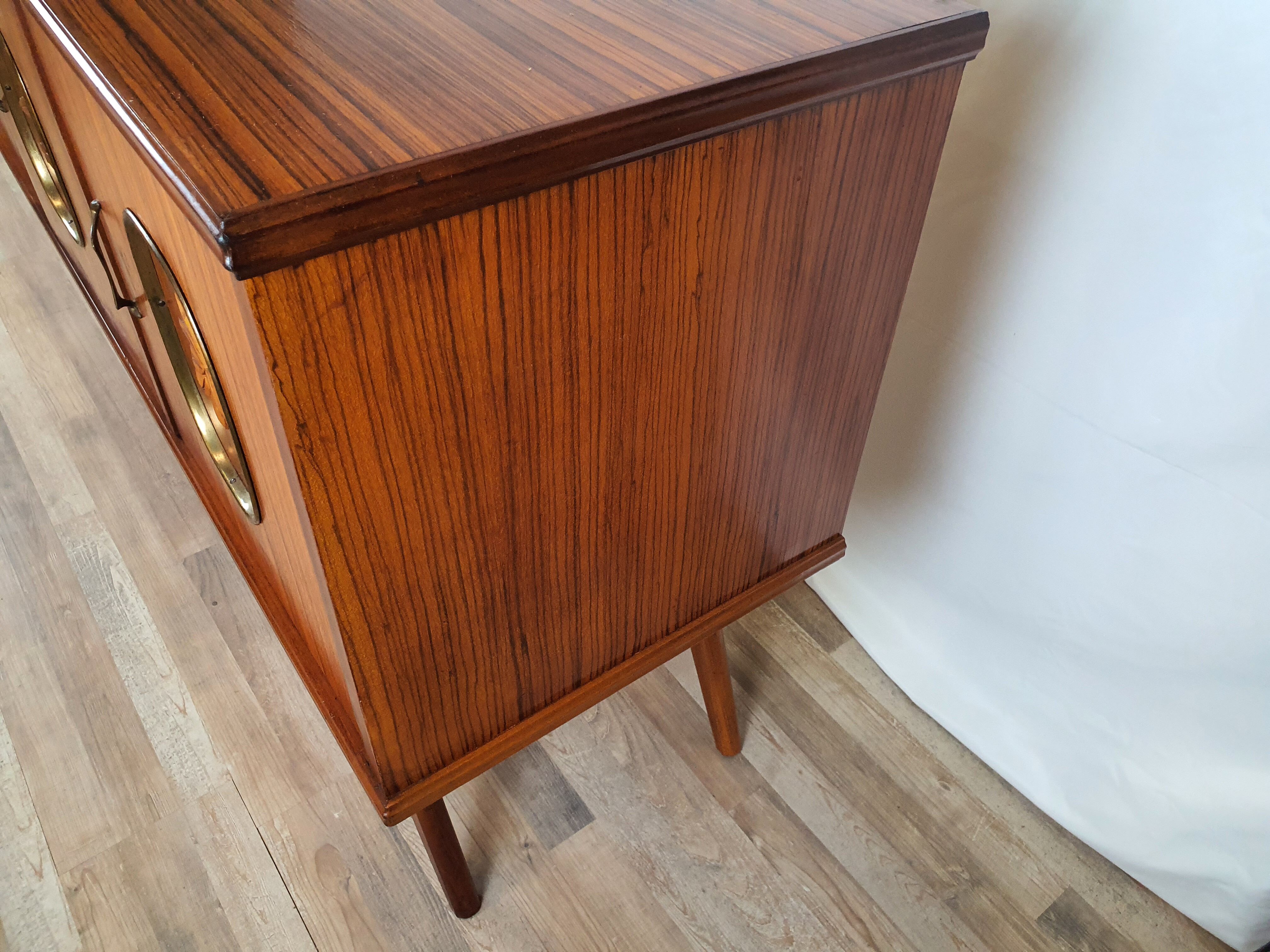 1960s sideboard with decorated doors in wood and brass