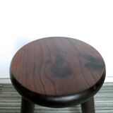 Dark wooden tripod stool