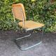 Wooden chair with caning in the style of Marcel Breuer.